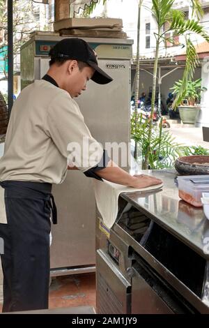 Pizza chef preparing pizza in a restaurant kitchen Stock Photo