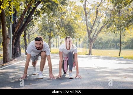 Couples are preparing to run in the morning at the park. Stock Photo