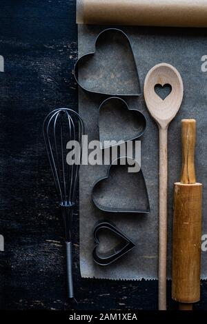 Cookies bake concept for holiday St. Valentine Day on wooden background with copy space Stock Photo