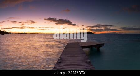 Jetty and Sofitel Private Island at dawn, Bora Bora, Society Islands, French Polynesia Stock Photo