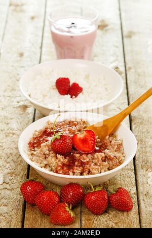 Healthy breakfast. Different food on the wooden table. Stock Photo