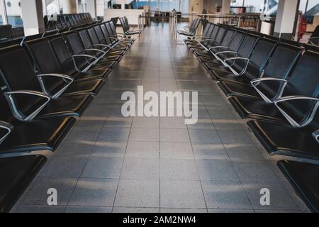 empty seats in waiting lounge on airport Stock Photo