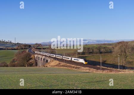 Virgin Trains / Avanti west coast class 390 Alstom  Pendolino train on the west coast mainline in Cumbria Stock Photo