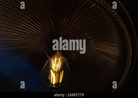 Close up of a filament lamp and hood cover - Inside of a light Stock Photo