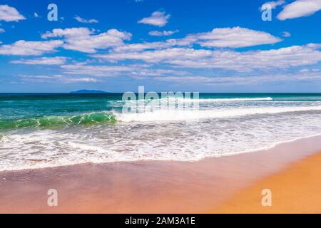 Waves and sand at Whiritoa Beach, Waikato, North Island, New Zealand Stock Photo