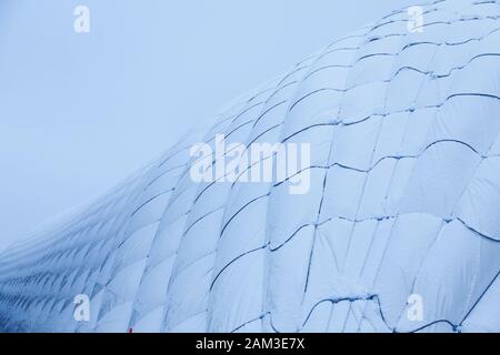 Umea, Norrland Sweden - December 20, 2019: big football and soccer tent on which it snowed Stock Photo