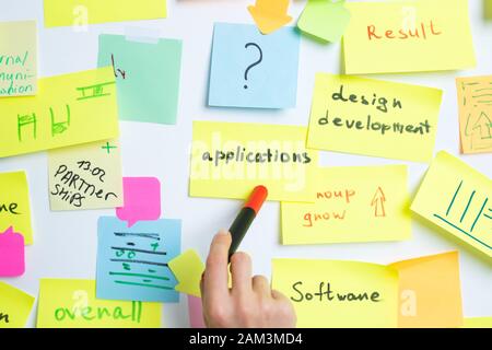 Business people use sticky notes post, writing down ideas. Teamwork. Stock Photo