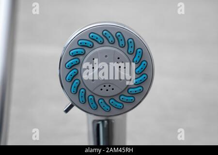 Modern shower head in modern bathroom. Shower head in bathroom with water spray or water flow. Feeling relax and enjoy in private bathroom. Fresh Stock Photo