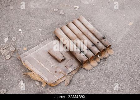 Remnants of fireworks and packagings spoil the streets after the traditional new years celebration Stock Photo