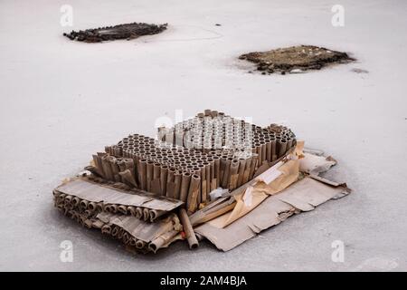 Remnants of fireworks and packagings spoil the streets after the traditional new years celebration Stock Photo