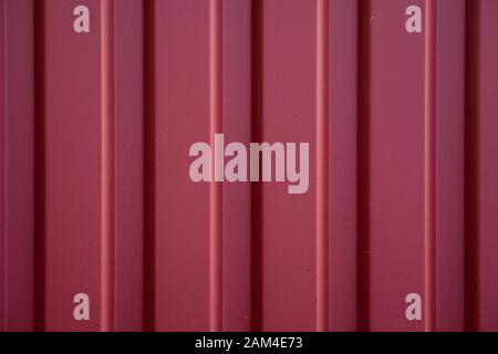 Red Corrugated metal sheet texture surface of the wall. Galvanize steel background. Stock Photo