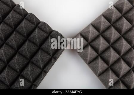 Sound proof Acoustic black gray foam absorbing, pyramid style padding layer panel for voice recording studio attach on wall as wallpaper background to Stock Photo