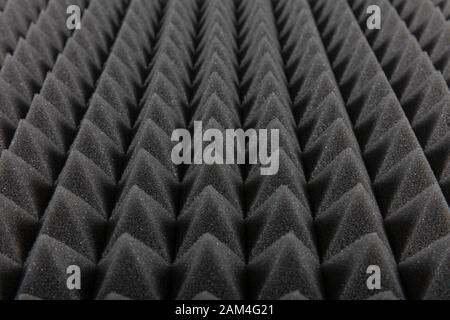 Sound proof Acoustic black gray foam absorbing, pyramid style padding layer  panel for voice recording studio attach on wall as wallpaper background to  Stock Photo - Alamy