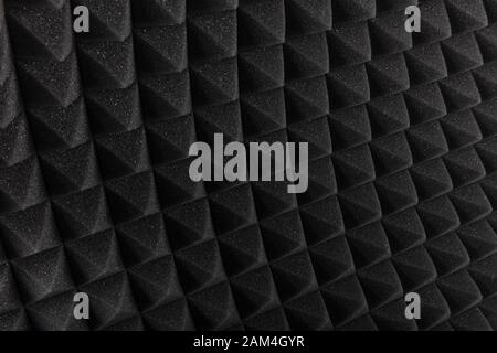 Sound proof Acoustic black gray foam absorbing, pyramid style padding layer panel for voice recording studio attach on wall as wallpaper background to Stock Photo