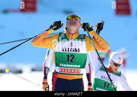 Trento, Italy. 11th January 2020; Lago Di Tesero, Val Di Fiemme, Trento, Italy; International Ski Federation World Cup, FIS Nordic Combined Val Di Fiemme, Vinzenz Geiger (GER) celebrates as he finishes - Editorial Use Credit: Action Plus Sports Images/Alamy Live News Stock Photo