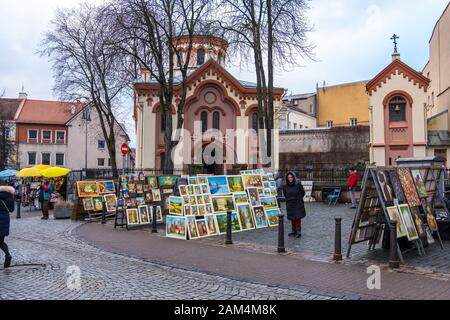 Vilnius, Lithuania - December 15, 2019: Street trade in paintings and souvenirs near Eastern Orthodox Church of St. Paraskeva in Vilnius, Lithuania Stock Photo