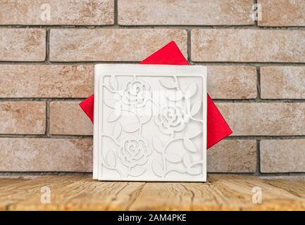 A table in a cafe or restaurant. Napkins in a metal napkin holder on a wooden table Stock Photo