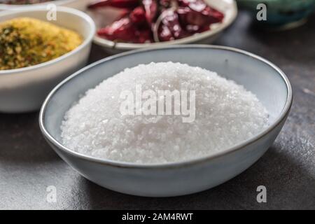 Salt and variety spices and herbs in bowls Stock Photo