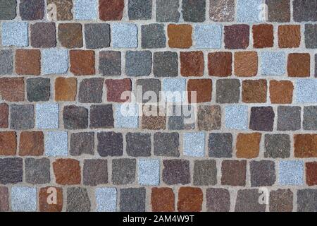 Detail of a cobblestone made of different colored paving stones Stock Photo