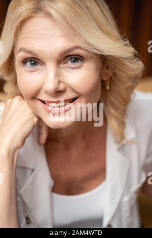 Cheerful lady posing indoors Stock Photo - Alamy