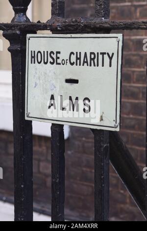 house of charity collection pipe, Alms, The Penny Chute Stock Photo