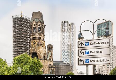 guideposts,  parking in charlottenburg borough, kaiser wilhelm memorial church, upper west tower and zoofenster tower in background Stock Photo