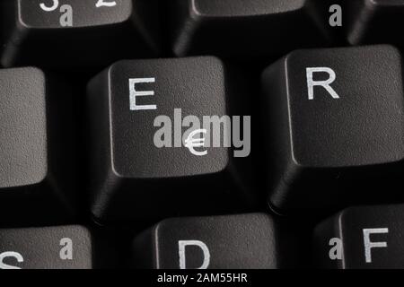 Close-up view of a computer keyboard with a key printed with the euro currency symbol. Stock Photo