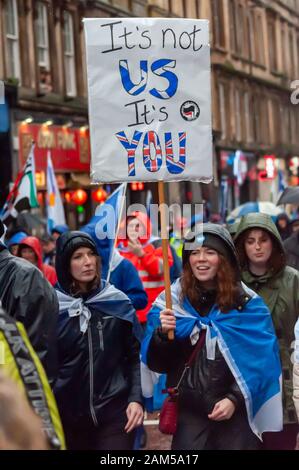 Glasgow, Scotland, UK. 11th Jan, 2020. Campaigners in support of Scottish Independence march through the streets of Glasgow. The march was organised by the group All Under One Banner and travelled from Kelvingrove Park through the city to Glasgow Green. Credit: Skully/Alamy Live News Stock Photo