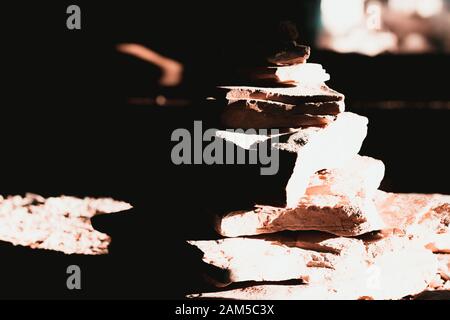 Stack of marble rock plates , dark image black and white with harsh dark shadows Stock Photo
