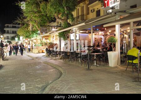 Outdoor night life in old town Rethymnon on a beautifully warm early summer evening on the lovely island of Crete. Stock Photo