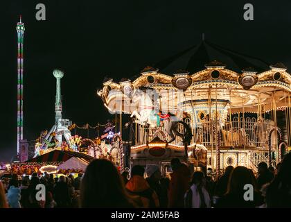 London, UK/Europe; 22/12/2019: Night view of Winter Wonderland, amusement park located in Hyde Park, London. People enjoying at Christmas fairs. Stock Photo