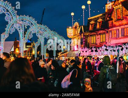 London, UK/Europe; 22/12/2019: Night view of Winter Wonderland, amusement park located in Hyde Park, London. People enjoying at Christmas fairs. Stock Photo