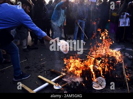 Students of Several collage burn an effigy of India's Prime Minister Narendra Modi during a protest rally against the NRC, CAA in Kolkata, India Stock Photo