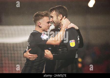 SALFORD, ENGLAND - JANUARY 11TH Andy Williams of Northampton Town FC celebrates with Sam Hoskins of Northampton Town FC after scoring his sides second goal during the Sky Bet League 2 match between Salford City and Northampton Town at Moor Lane, Salford on Saturday 11th January 2020. (Credit: Tim Markland | MI News) Stock Photo