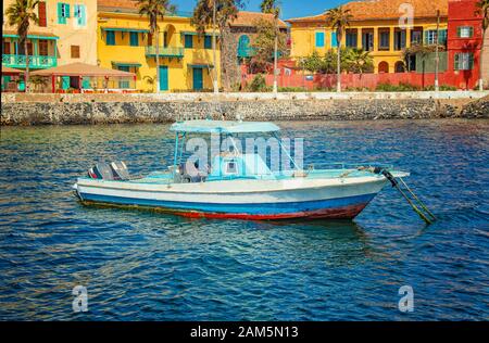 View to boat near small historic town at the island in Africa. It is small island near Dakar. It was was the largest slave trade center on the African Stock Photo
