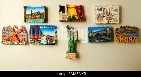 Magnets on refrigerator from travelling - stock photo, souvenir shopping Stock Photo