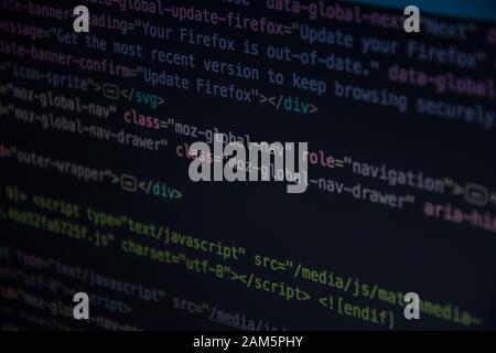 Close up css HTML code on monitor screen with black background Stock Photo