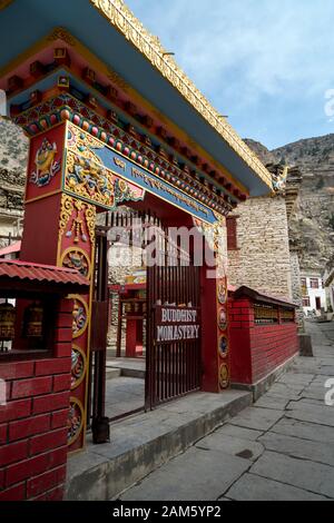 Entrance gate to Buddhist monastery in Marpha, a small village in Mustang district, Nepal Stock Photo