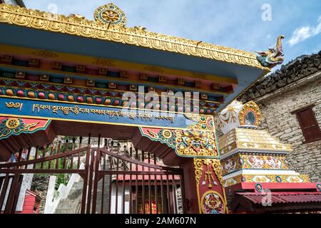 Entrance gate to Buddhist monastery in Marpha, a small village in Mustang district, Nepal Stock Photo