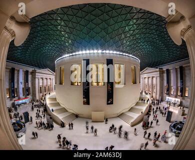 London, England, UK - January 4, 2020: Wide view of the interior architecture and tourists visiting the central square inside British Museum Stock Photo
