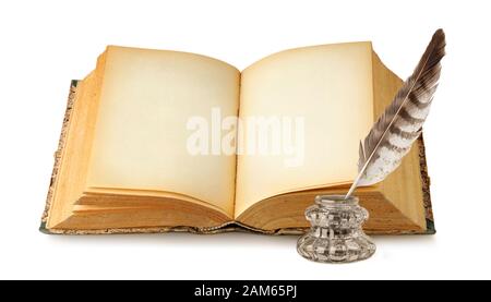 Isolated book with empty pages. One open book with black space, ink and quill isolated on white background with clipping path Stock Photo