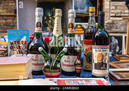 Flea market with old wine bottles, Mussolini reserve Stock Photo