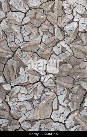 Dry cracked earth top view. Drought season on earth. dry ground environmental problems and global warming. Stock Photo