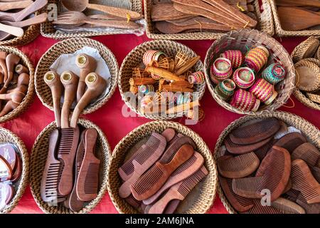 Souvenir wooden bowls on the market at Luang Prabang in Laos. Homemade artworks by local people. Stock Photo