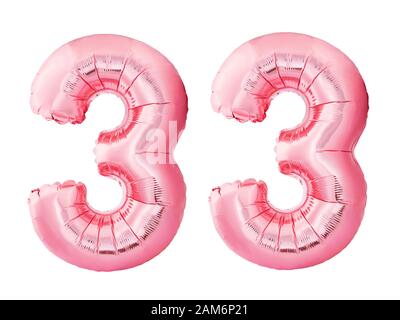 Number 31 thirty one made of rose gold inflatable balloons isolated on white background. Pink helium balloons forming 31 thirty one Stock Photo