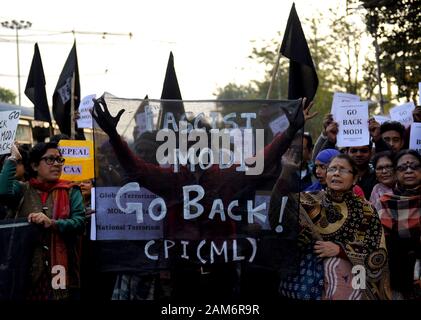 Kolkata, India. 11th Jan, 2019. Protesters hold placards and a banner that says Modi Go Back during the demonstration.Demonstration against the visit of India's Prime Minister Narendra Modi and also against (Citizenship Amendment Bill) or CAB which grants Indian citizenship to non-Muslims of Afghanistan, Pakistan and Bangladesh that was passed by the Indian Government in December 2019 and has created violence, strike and protest all over the India. Credit: Avishek Das/SOPA Images/ZUMA Wire/Alamy Live News Stock Photo