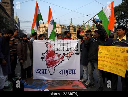 Kolkata, India. 11th Jan, 2019. Protesters hold a banner and flags during the demonstration.Demonstration against the visit of India's Prime Minister Narendra Modi and also against (Citizenship Amendment Bill) or CAB which grants Indian citizenship to non-Muslims of Afghanistan, Pakistan and Bangladesh that was passed by the Indian Government in December 2019 and has created violence, strike and protest all over the India. Credit: Avishek Das/SOPA Images/ZUMA Wire/Alamy Live News Stock Photo