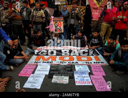 Kolkata, India. 11th Jan, 2019. Protesters hold a banner during the demonstration.Demonstration against the visit of India's Prime Minister Narendra Modi and also against (Citizenship Amendment Bill) or CAB which grants Indian citizenship to non-Muslims of Afghanistan, Pakistan and Bangladesh that was passed by the Indian Government in December 2019 and has created violence, strike and protest all over the India. Credit: Avishek Das/SOPA Images/ZUMA Wire/Alamy Live News Stock Photo