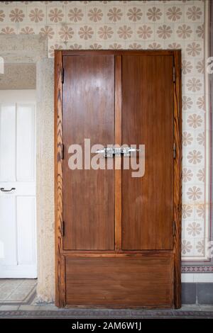 Old wooden door in an abandoned hospital Stock Photo