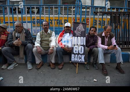 Kolkata, India. 11th Jan, 2019. A protester holds a placard during the demonstration.Demonstration against the visit of India's Prime Minister Narendra Modi and also against (Citizenship Amendment Bill) or CAB which grants Indian citizenship to non-Muslims of Afghanistan, Pakistan and Bangladesh that was passed by the Indian Government in December 2019 and has created violence, strike and protest all over the India. Credit: Avishek Das/SOPA Images/ZUMA Wire/Alamy Live News Stock Photo